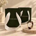 Custom Dark Green Luxury Paper Shopping Bags with Ivory Grosgrain Ribbon Handles