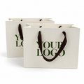 Custom 270gsm Ivory Specialty Paper Shopping Bags with Brown Grosgrain Ribbon Handles