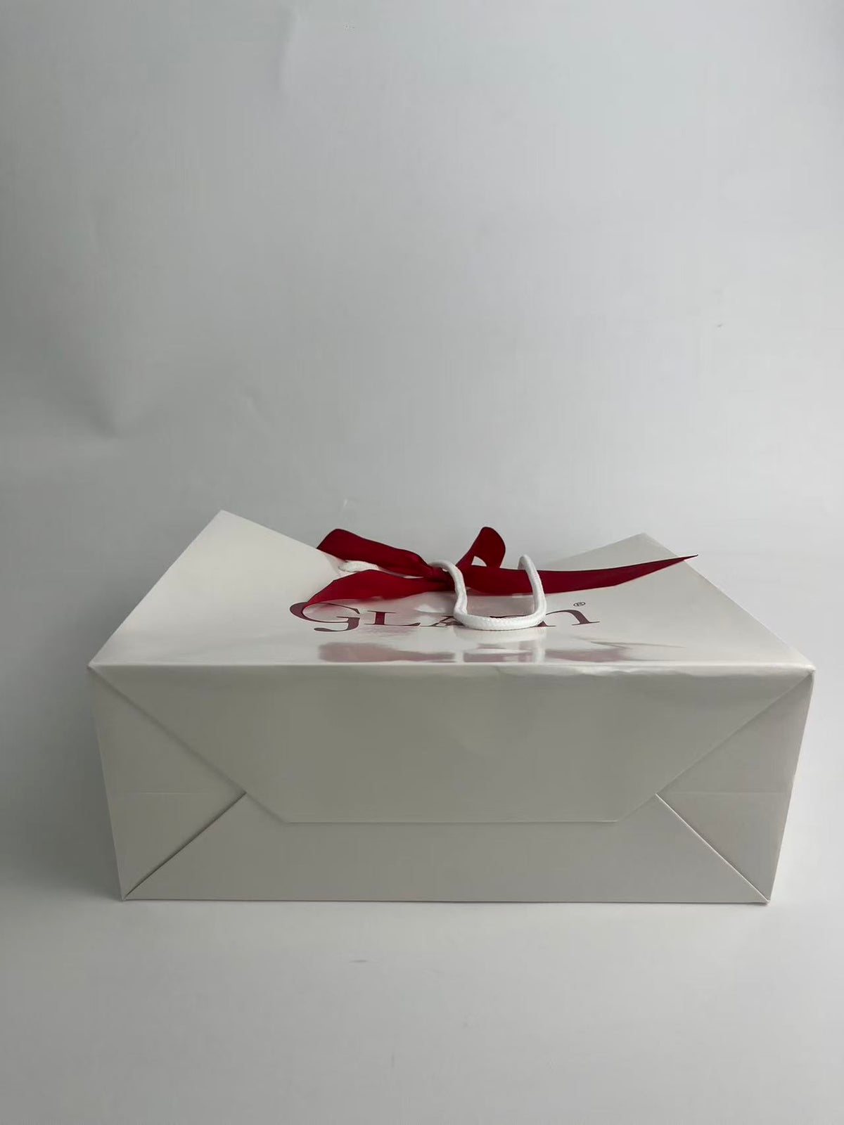 Custom Luxury Perfume Paper Bags with Satin Bow Closure and Rope Handles
