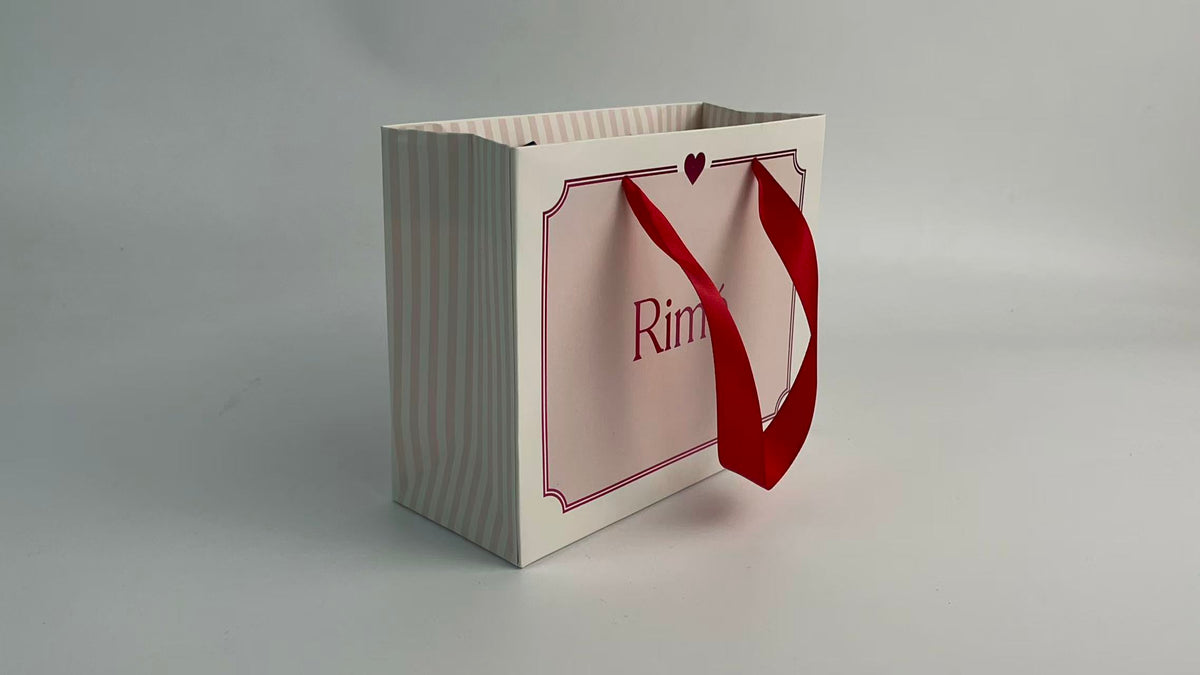 Pink Striped Cosmetic Gift Bag with Red Ribbon | Custom Skincare Packaging