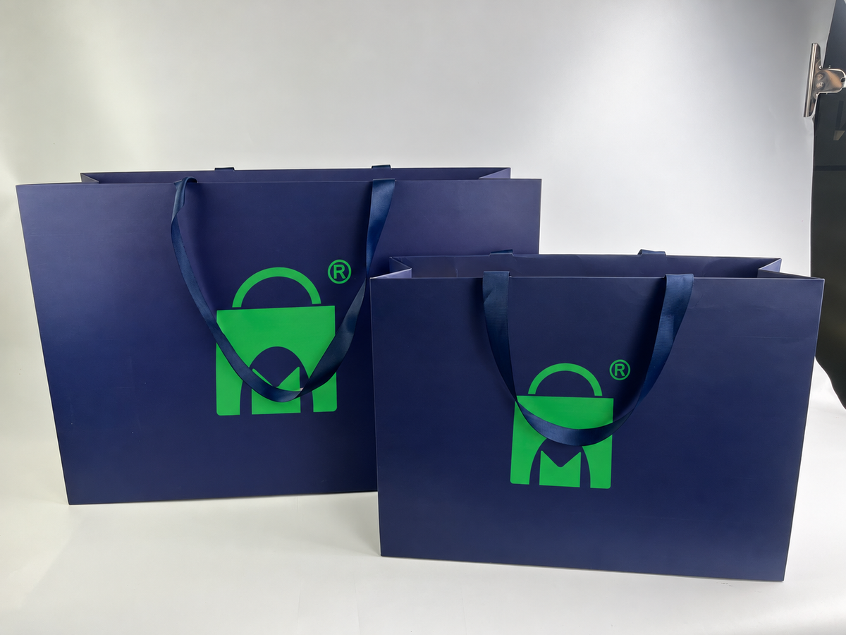 Custom Navy Blue Paper Shopping Bags | Ivory Interior & Satin Ribbon Handles | Luxury Retail Packaging